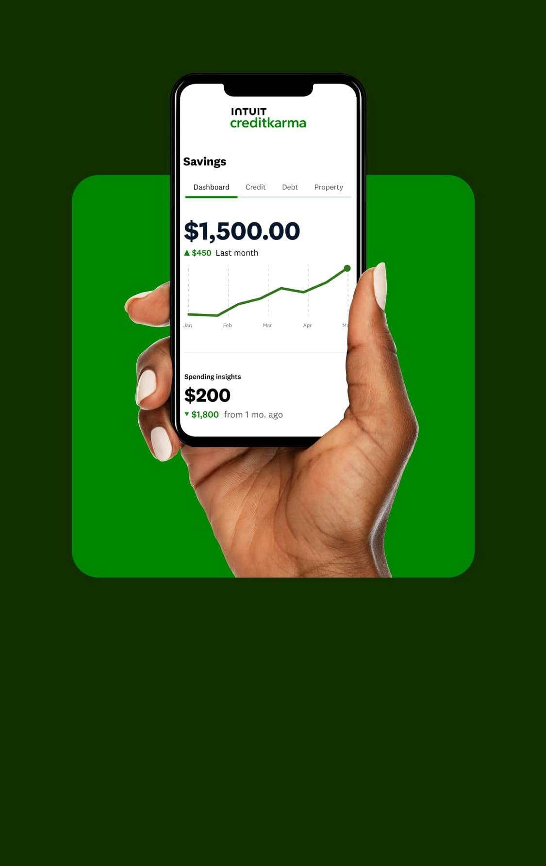 Hand holding cell phone with a Credit Karma line graph trending upwards for savings.